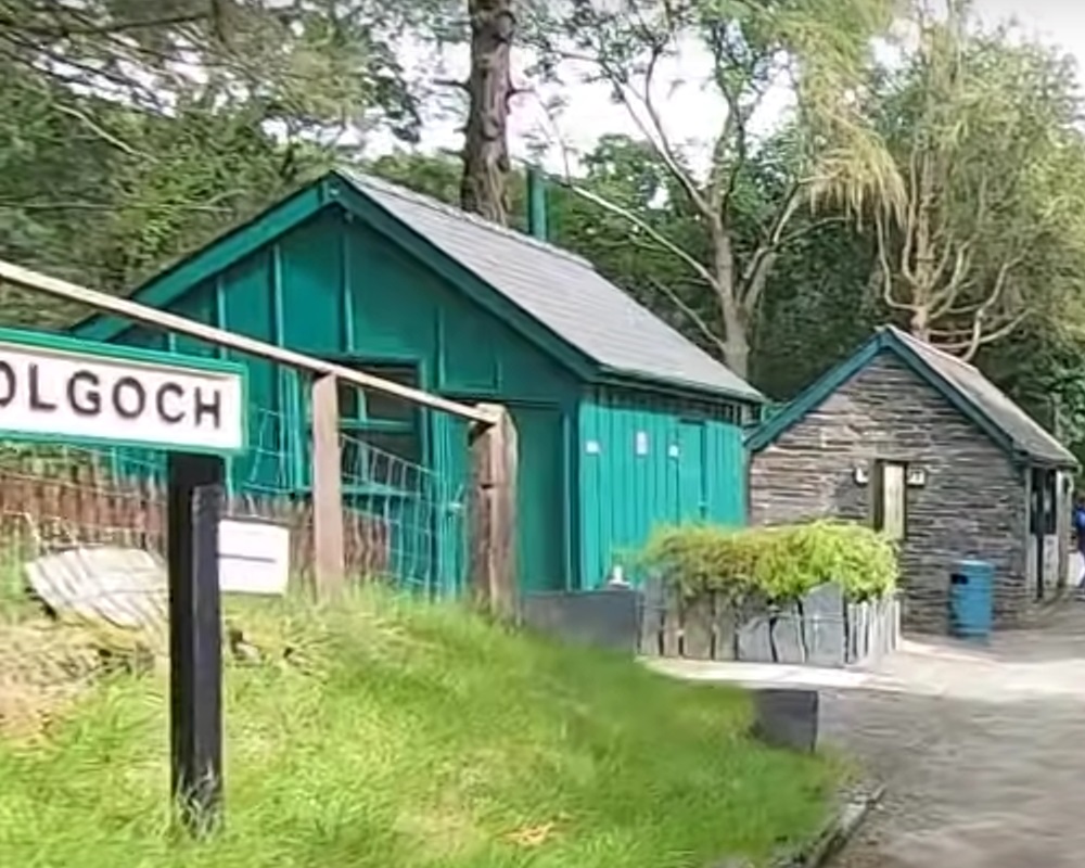 The pale green side of the toilet building at Dolgoch.