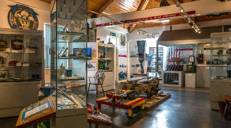 The museum with glass display cases and demonstration signal levers on the back wall.