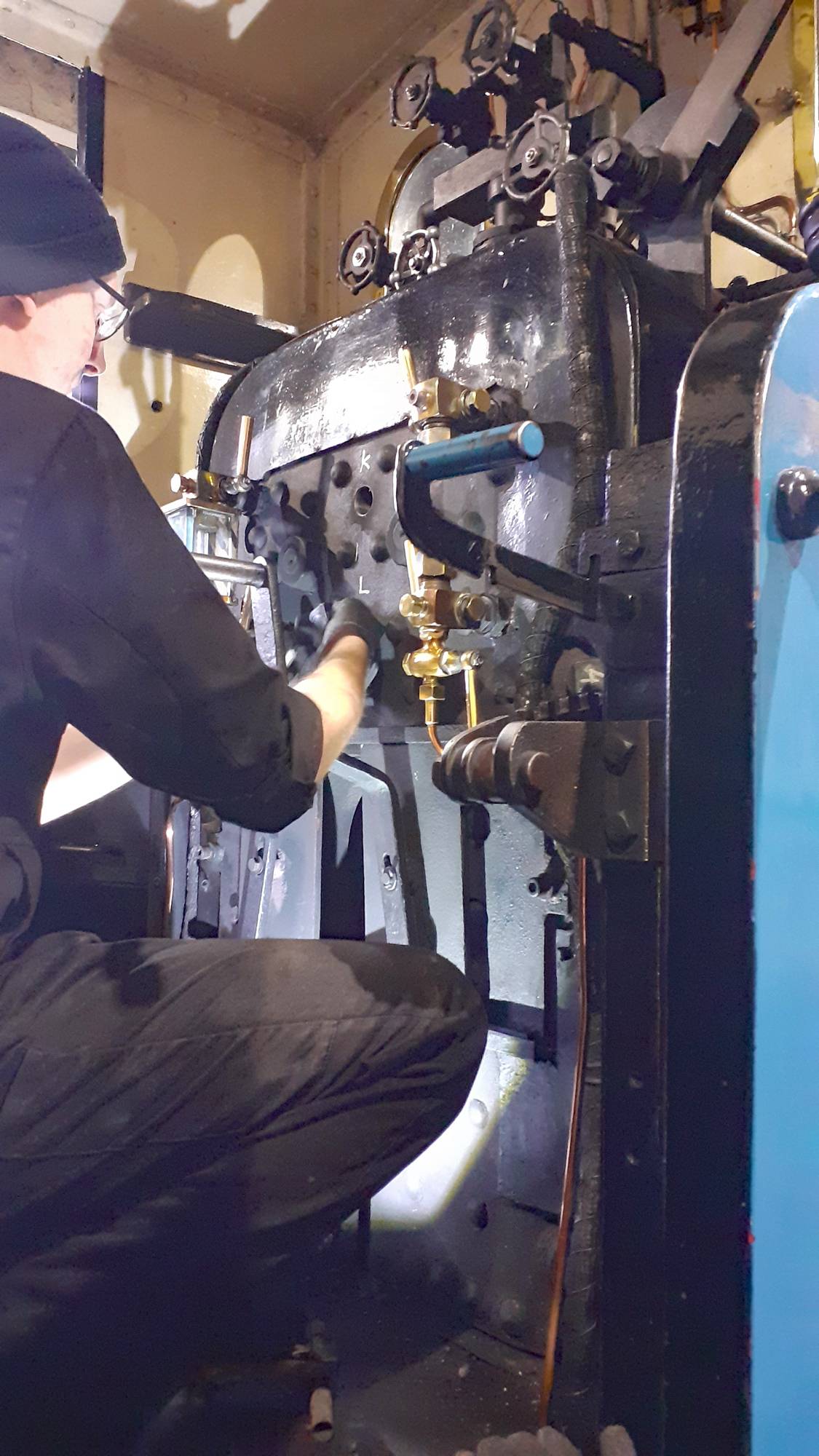 A person cleaning out plug holes on No 6.