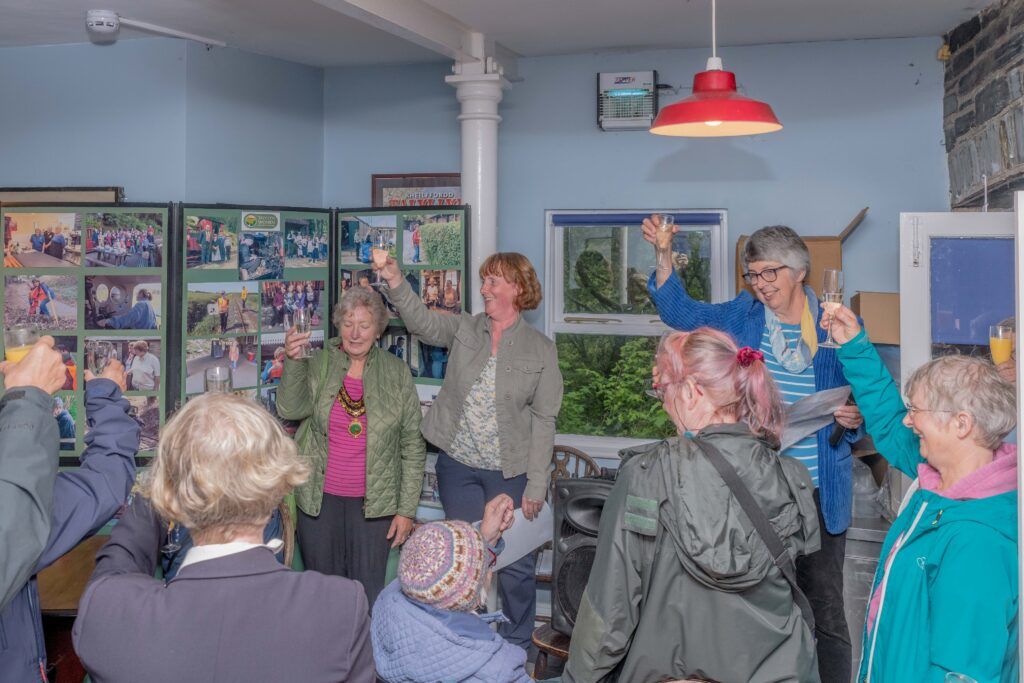 A group of women raising a glass.