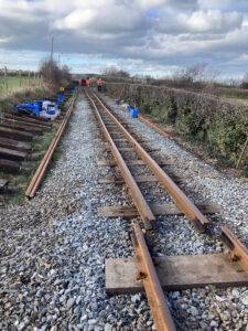 Two rails lying on top of sleepers.